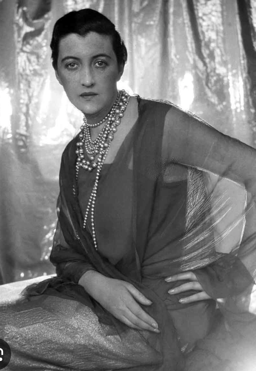 Portrait photograph of Dolly Wilde, Oscar Wilde's niece, showing the striking resemblance to her famous uncle